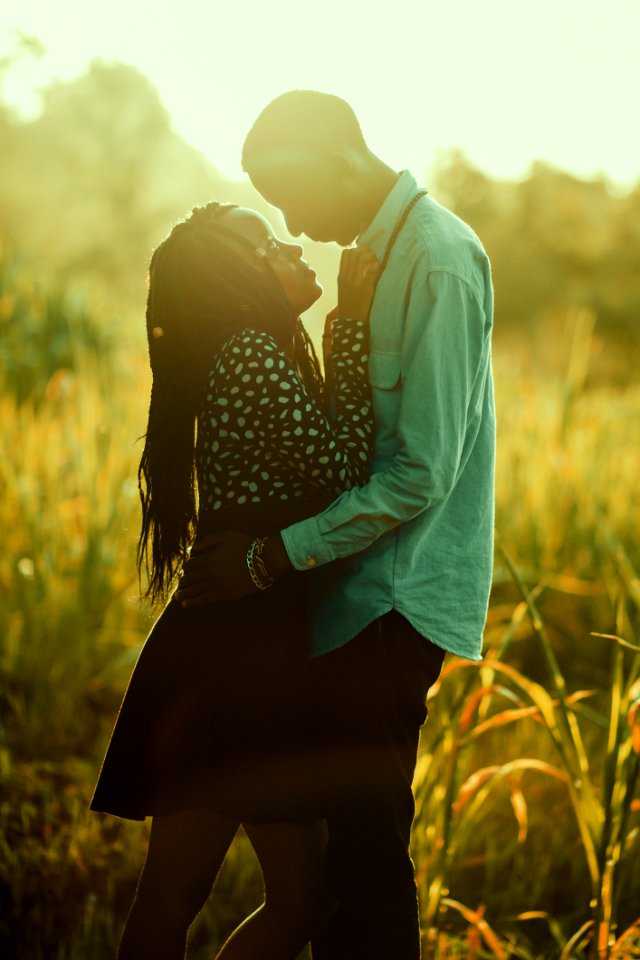 Photograph Of Man And Woman On Grass Field