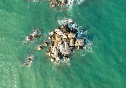 Top View Of Rock Formations Surrounded By Water photo