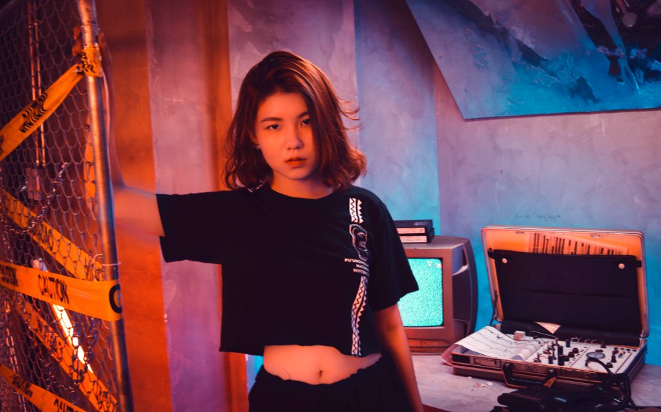 Woman Wearing Crop Top Standing Near Wire Fence