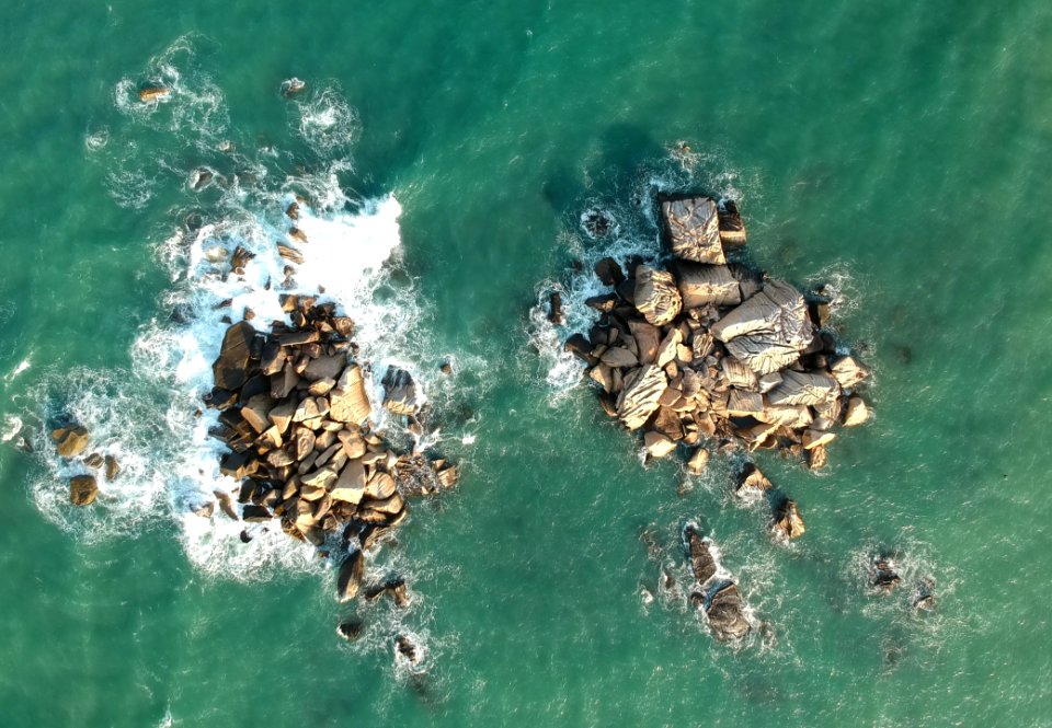 Birds Eye View Of Rocks In Ocean
