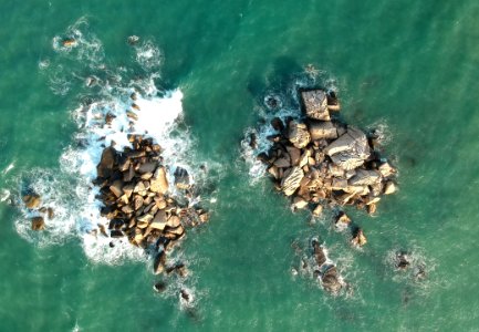 Birds Eye View Of Rocks In Ocean photo