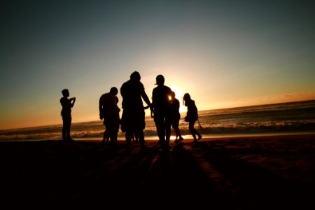 Silhouette Photo Of People At The Seashore photo