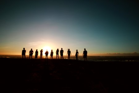 Silhouette Of People During Sunset photo