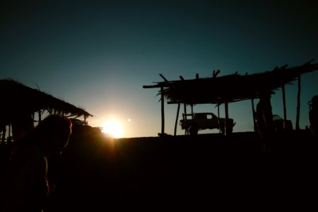 Silhouette Of Pickup Truck Near Hut
