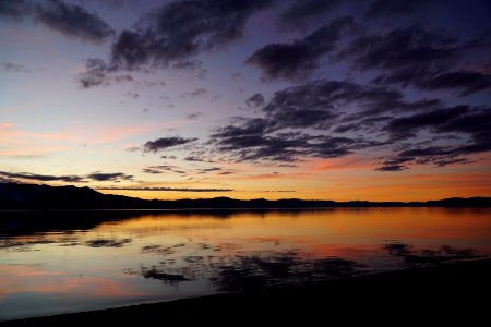 Silhouette Of Mountain And Body Of Water