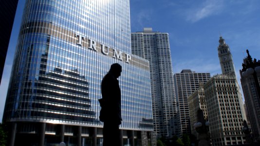 Silhouette Of Statue Near Trump Building At Daytime photo