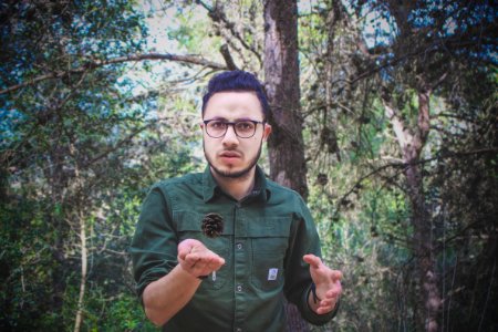 Man Wearing Green Dress Shirt And Surrounded By Trees photo