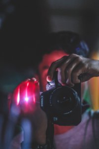 Person Holding Black Canon Dslr Camera photo