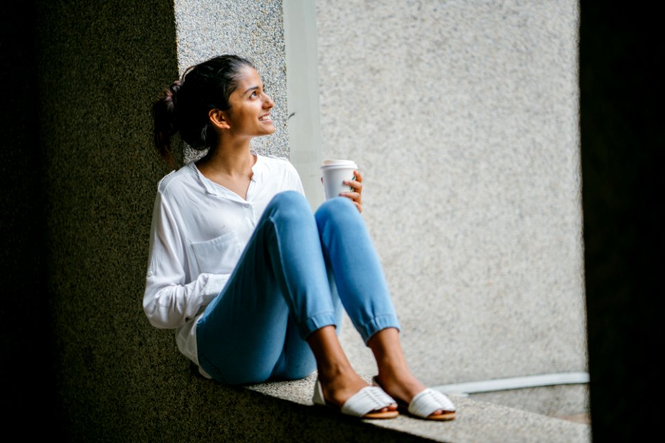 Woman Posing Wearing White Dress Shirt Sitting On Window