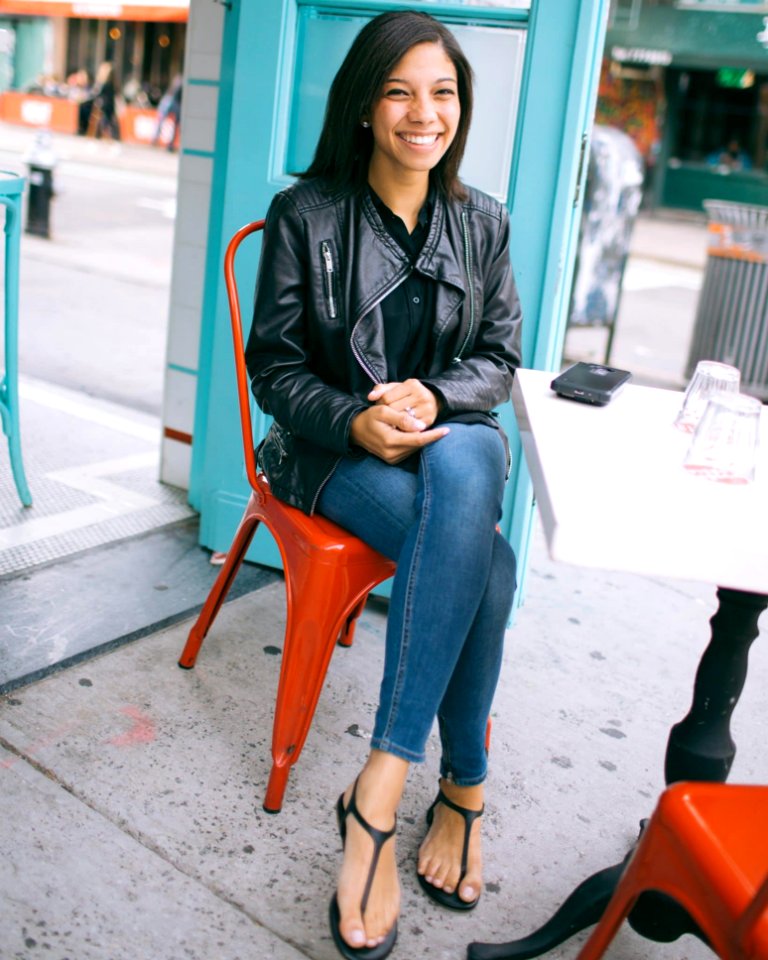 Woman Wearing Black Leather Zip-up Jacket And Blue Jeans photo