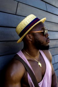 Man Wearing Hat And Pink Tank Top photo