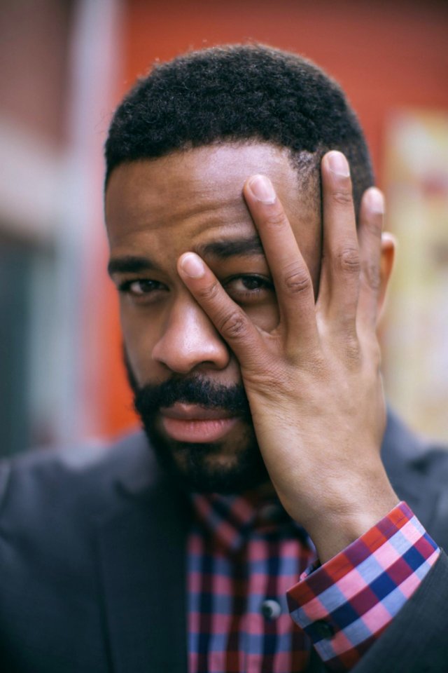 Selective Focus Photography Of Man Holding His Face