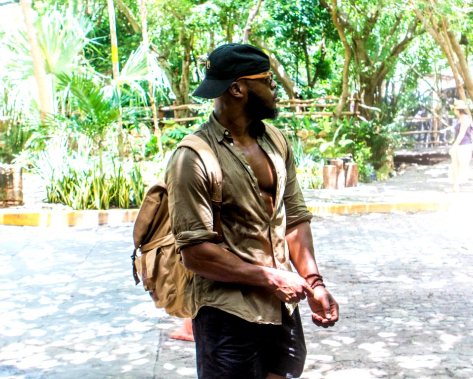 Man Wearing Hat And Backpack photo