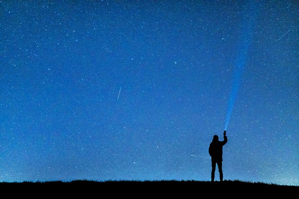 Silhouette Of Man Under Blue Sky During Nighttime