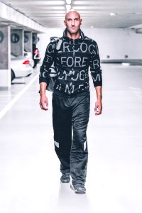 Man In Sweater And Pants Walking