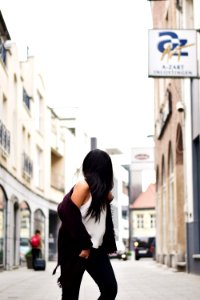 Woman Wearing White Tank Top With Maroon Jacket Crossing N Street photo