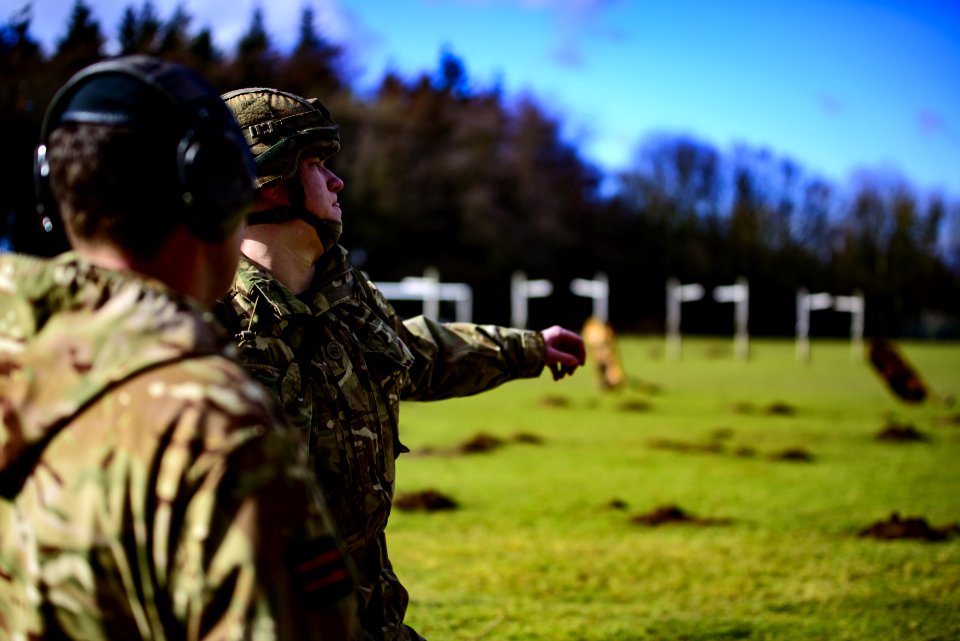 Selective Focus Photo Of A Soldier On Green Grass Field