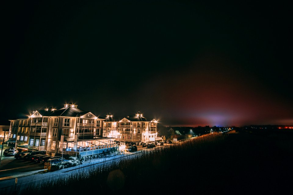 White Concrete Building Beside Body Of Water During Nighttime