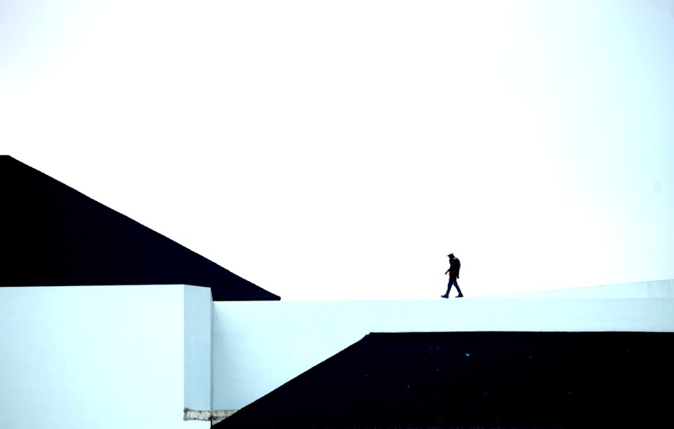 Man Walking On White Platform