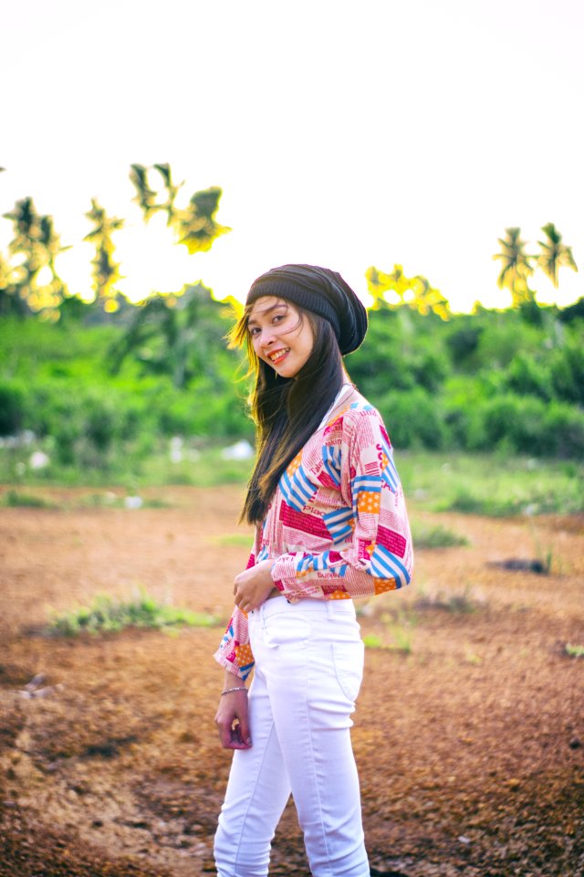 Woman Wearing Black Beanie Standing On Brown Soil Field