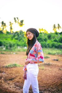 Woman Wearing Black Beanie Standing On Brown Soil Field