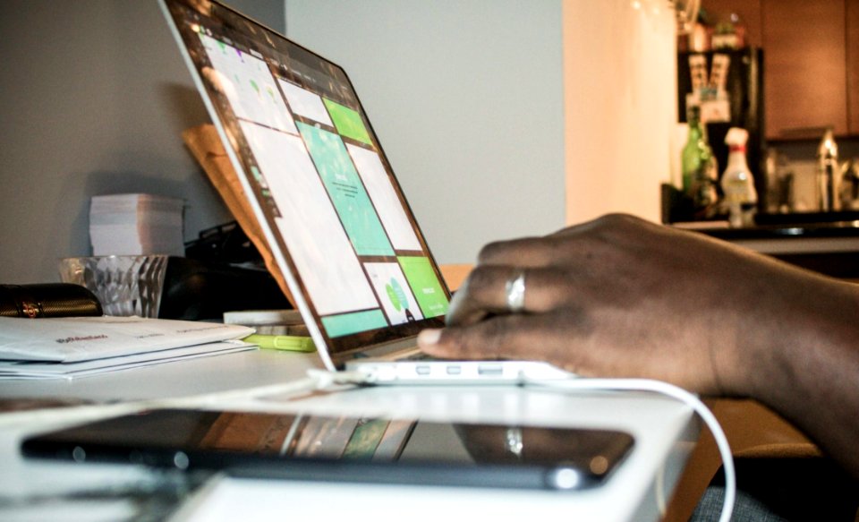 Person Using Laptop Computer Inside Room photo