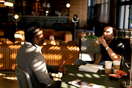 Two Men In A Conversation