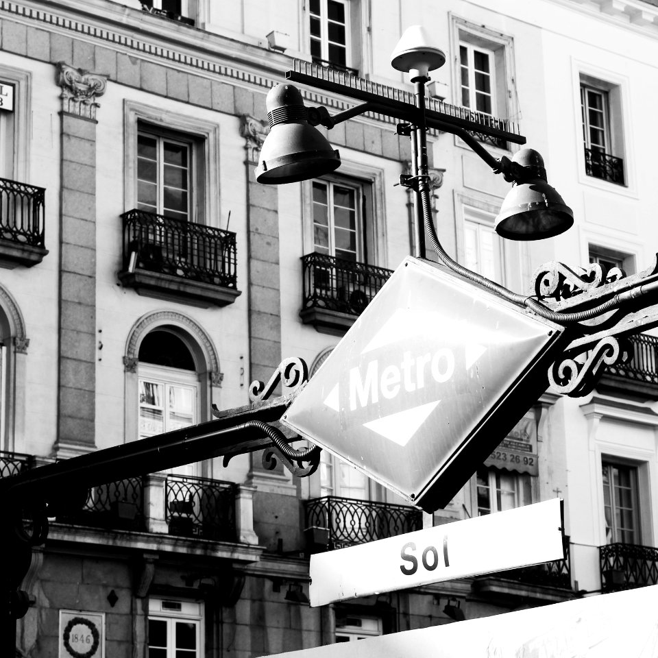 Grayscale Photography Of Patio Light And Sign