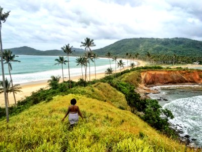Woman Standing On Hill Near The Sea Graphic Wallpaper