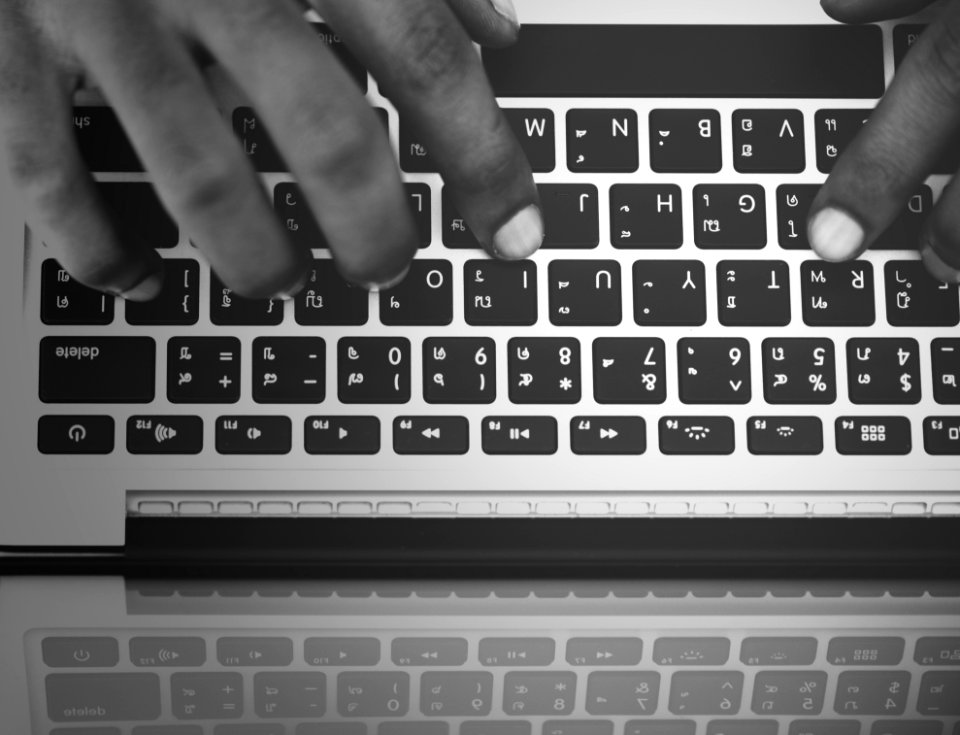 Persons Hand On Computer Keyboard