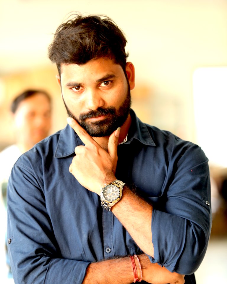 Photo Of Man Wearing Gray Button-up Shirt With Analog Watch