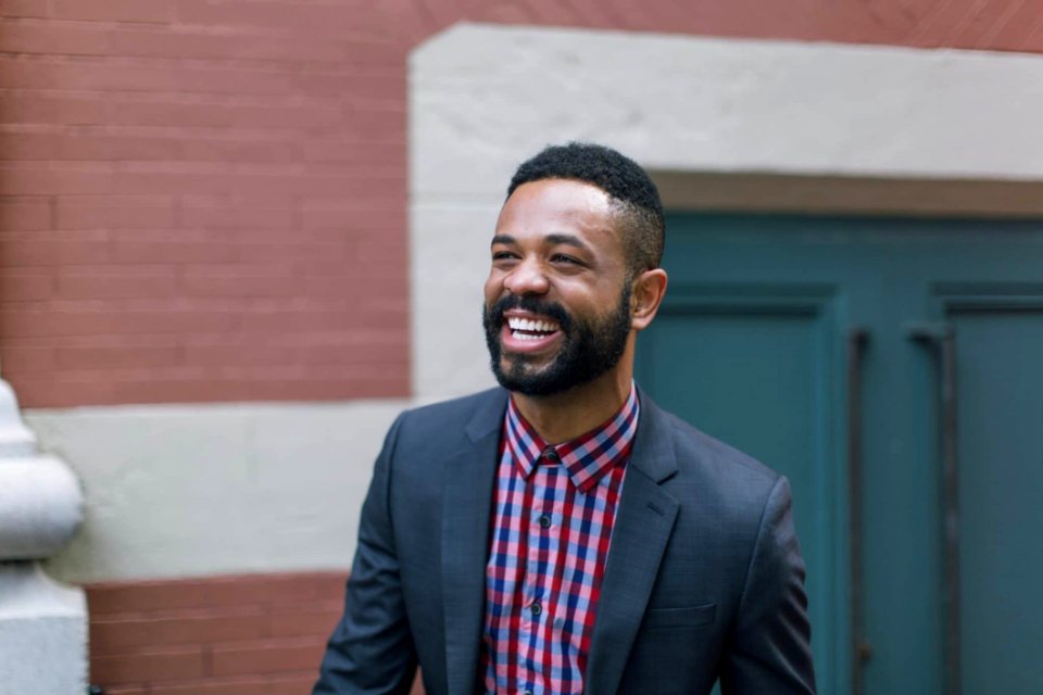 Man Wearing Black Notch Lapel Suit Jacket