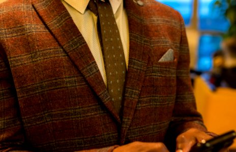 Person Wearing Red And Gray Plaid Suit Jacket photo
