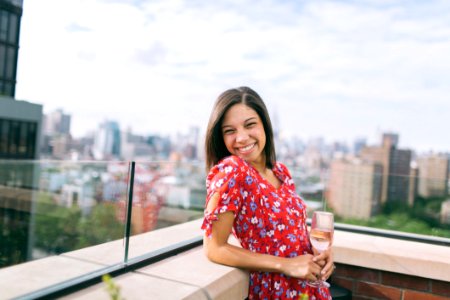 Woman Wearing A Floral Dress With The A Rooftop View photo