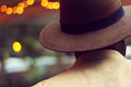 Shallow Focus Of Man In Brown Hat photo