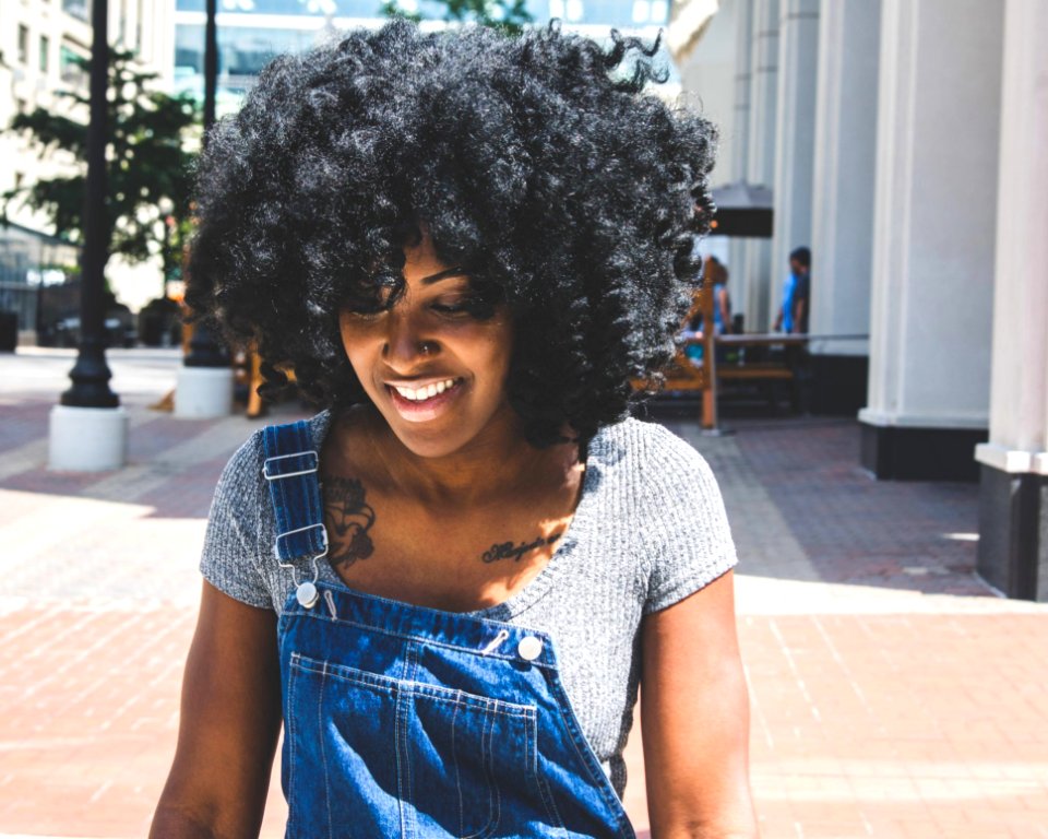 Woman In Gray Scoop-neck Shirt And Blue Denim Overalls