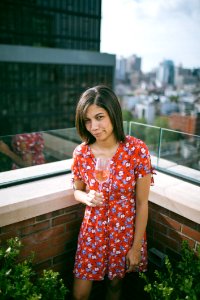 Woman Wearing Floral Dress Holding Wine Glass photo
