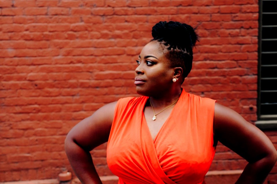 Woman Wearing Orange Sleeveless Top