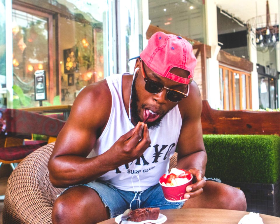 Man Eating Froyo With Strawberries