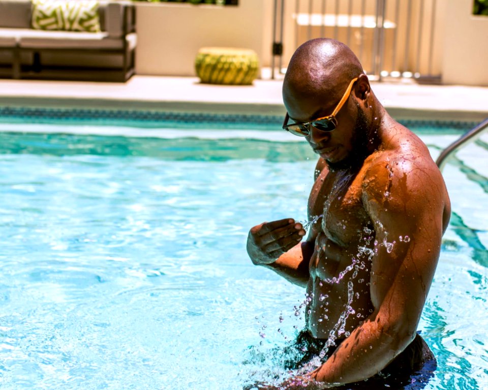Man Wearing Sunglasses In Swimming Pool