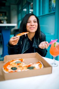 Woman Eating Pizza photo