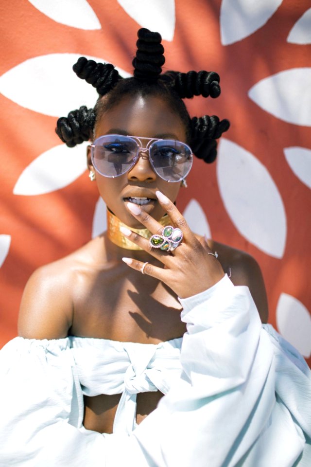 Photo Of Woman In White Crop Top And Silver-colored Framed Aviator Sunglasses