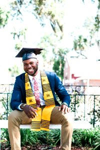 Photo Of Man Wearing Graduation Cap photo