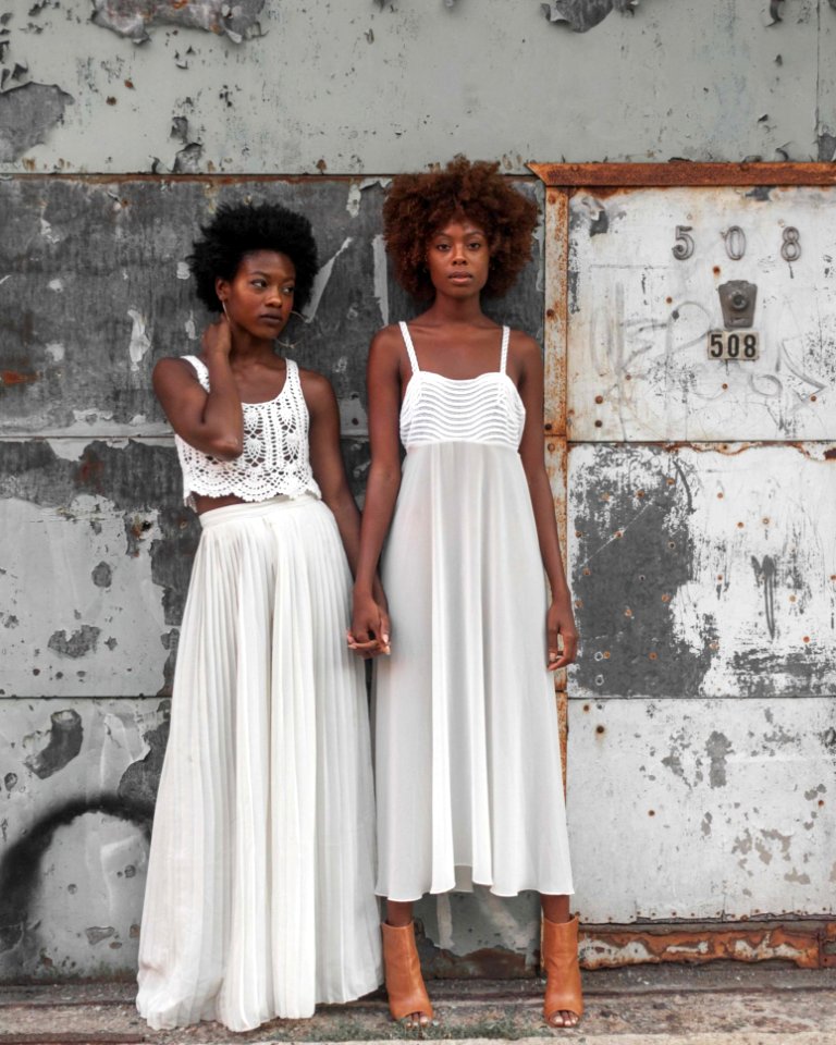 Photo Of Women In White Sleeveless Dresses