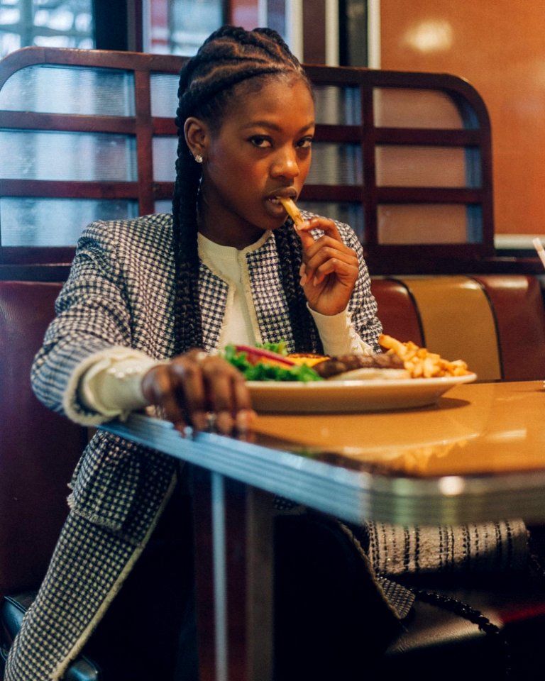 Photo Of A Woman Eating At The Restaurant