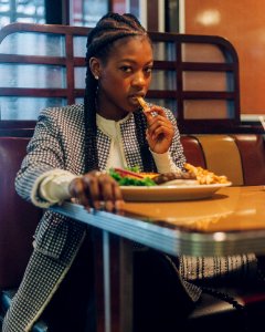 Photo Of A Woman Eating At The Restaurant photo