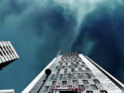 Worms Eye-view Photography Of White High-rise Building During Storm Weather photo
