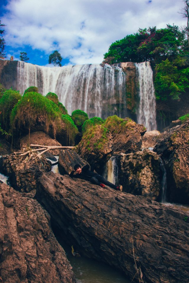 Person Laying On Brown Rock Formation