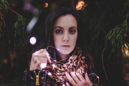 Woman Holding White String Lights photo