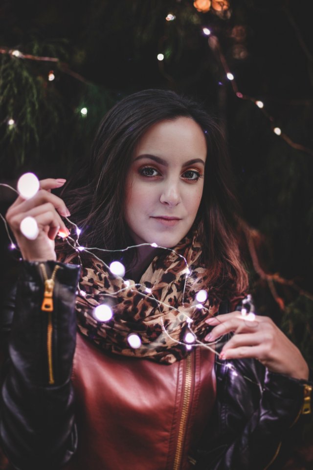 Woman Holding White String Lights photo